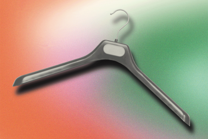 A clothing hanger on a red and green background