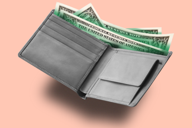 Open wallet with $1 bills, conveying financial anxiety