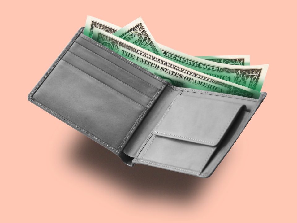 Open wallet with $1 bills, conveying financial anxiety