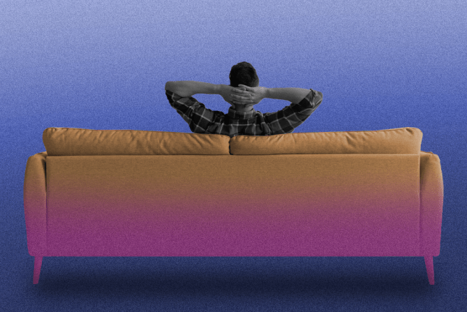 A guy sitting on a couch to represent how to be happy alone