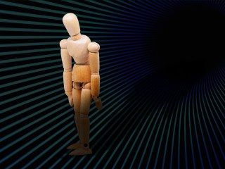 A mannequin figure draped in shadow to show what existential dread can feel like