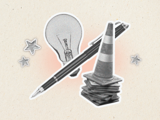 A lightbulb, pen, and parking cone