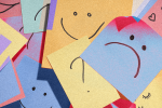Post-it notes with smiley and frowny faces to signify how a person with bipolar thinks