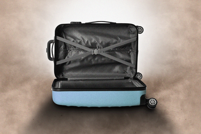 An empty suitcase under a dramatic drop shadow to symbolize post-vacation depression