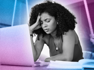 woman holding her head over laptop, in need of self soothing