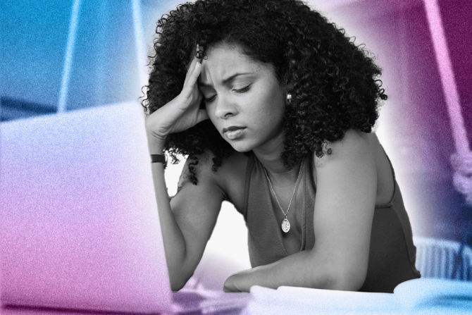 woman holding her head over laptop, in need of self soothing