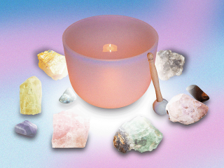 A song bowl surrounded by crystals used for energy healing
