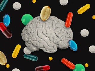 A brain surrounded by pills to represent antipsychotic medications