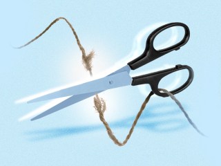 scissors cutting a string to represent how to break up with someone