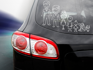 A bumper sticker with cartoons representing a family