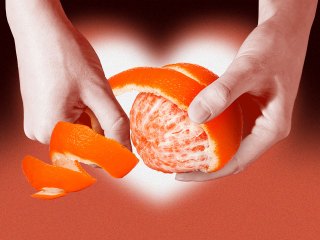 orange peel theory going viral on TikTok represented by hands peeling an orange