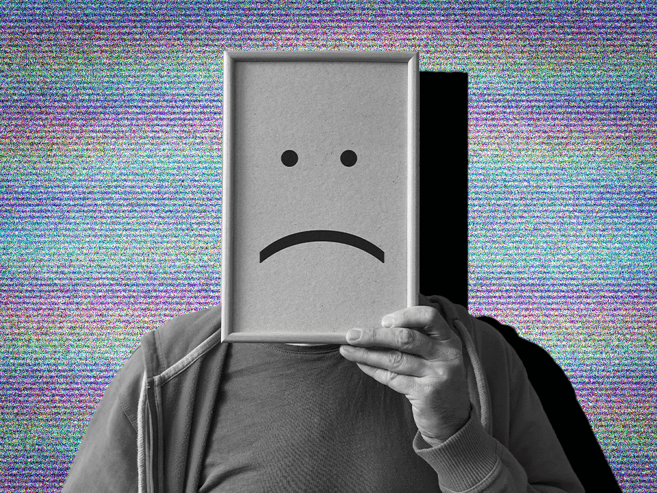 someone with a frowny face in front of them to represent dysthymia