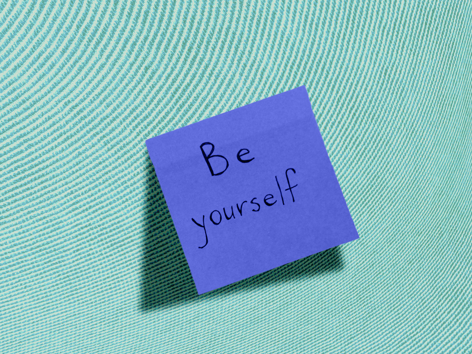A sticky note that says "be yourself"