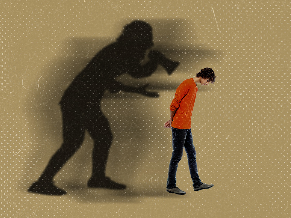 A person walking with a self-hate shadow behind them that's shouting, "I hate myself!"
