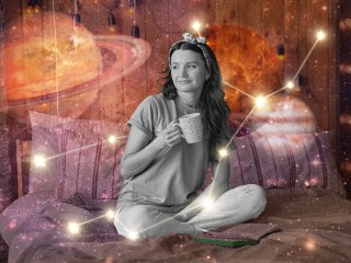 A woman drinking coffee in bed during the solar eclipse 2024