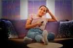 a woman watching tv to cope with stress