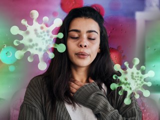 a woman putting a hand to her chest because she has health anxiety