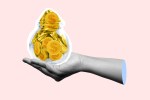 A hand holding a jar of cash. This person may need to see a financial therapist