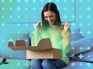 A woman opening a box looking excited